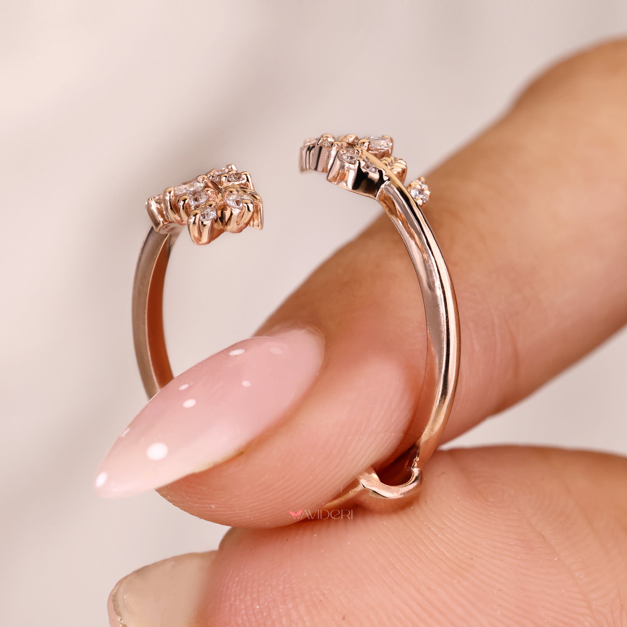 Rose gold band with a nature inspired design.