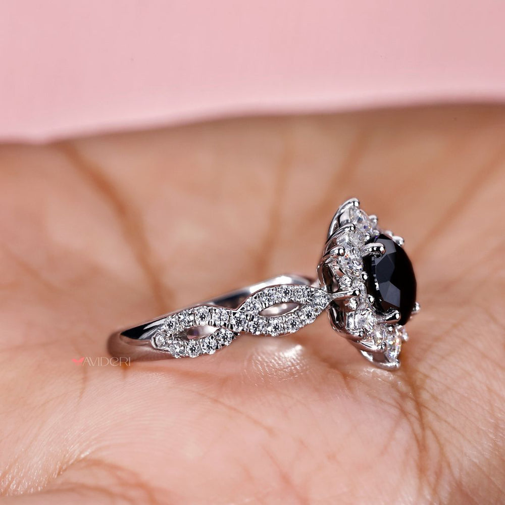 Twisted pave engagement ring with a round cut ring for a unique design.
