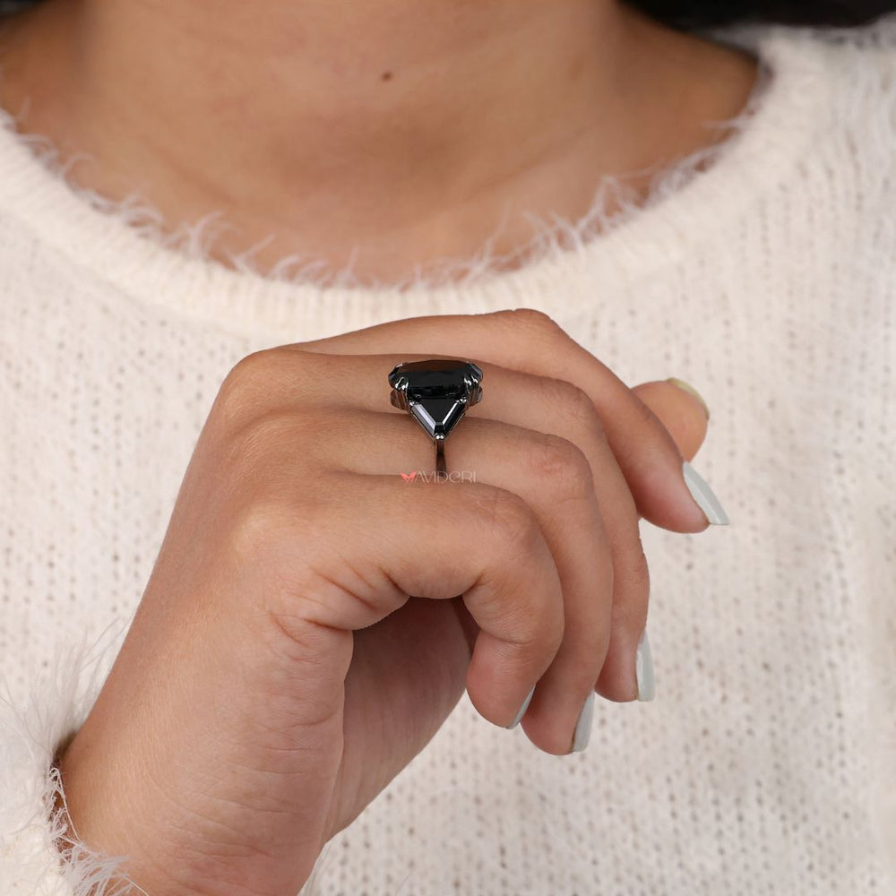 Black moissanite ring offering an elegant, dark gemstone look.
