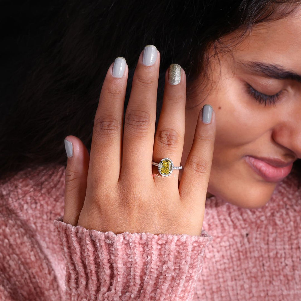 Round cut halo moissanite ring for a sparkling, elegant look.
