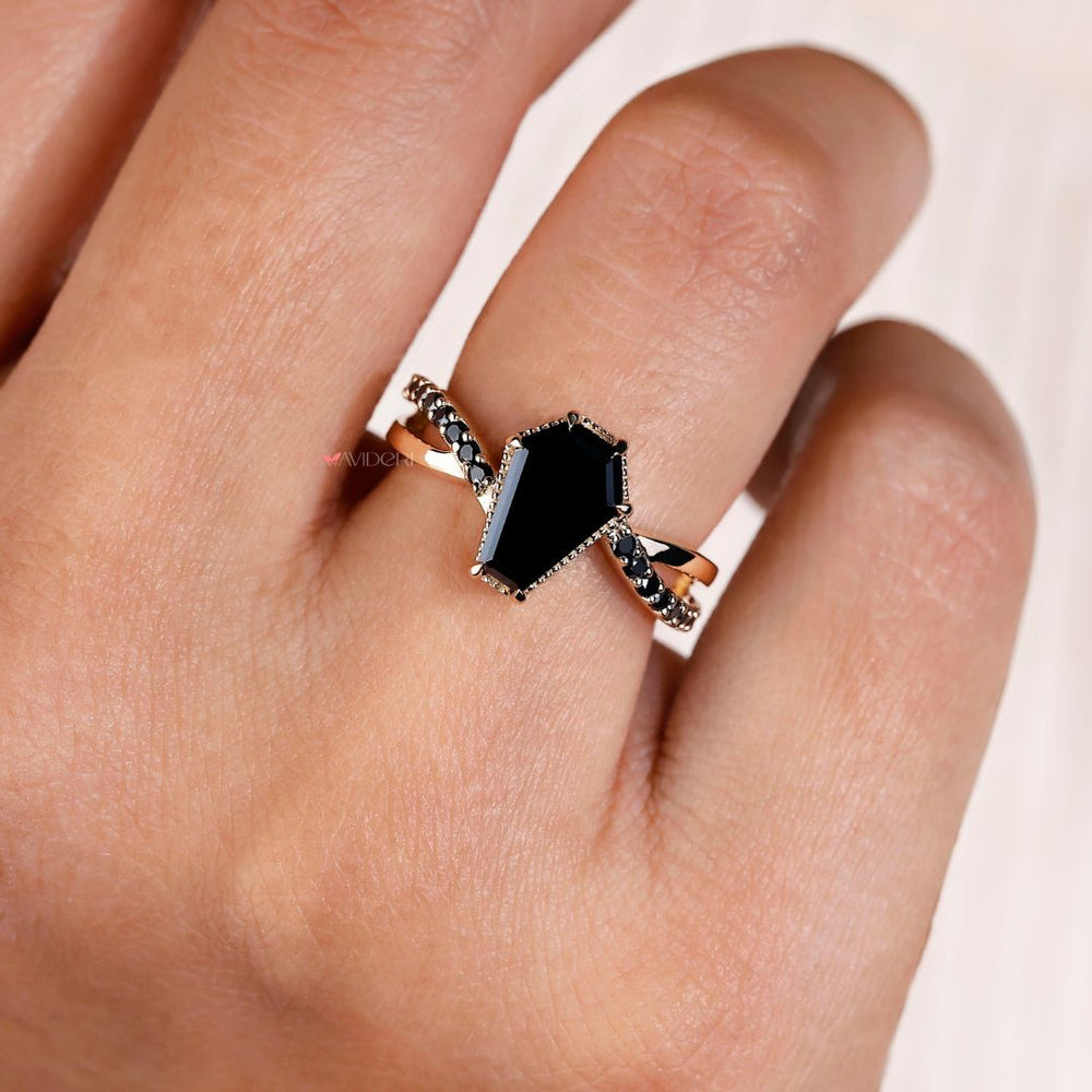 Beautiful coffin ring featuring a high-quality diamond center stone.
