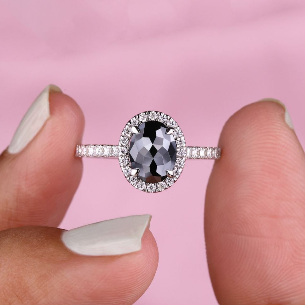 Oval moissanite ring set in a stunning oval halo engagement ring design.
