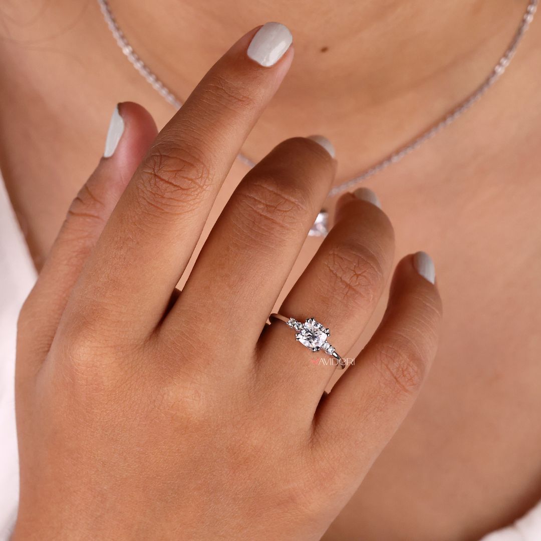 Double prong engagement ring securely holding the center stone with a strong and open view.
