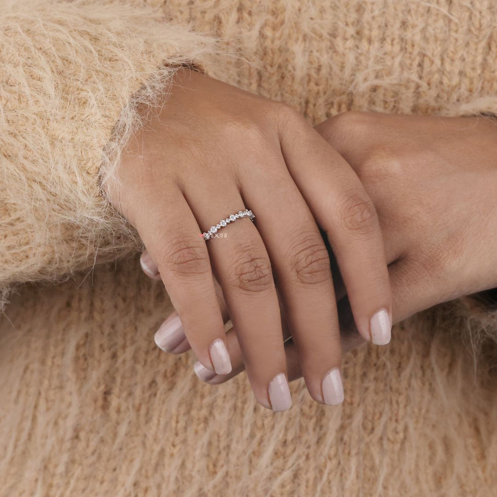 A bold moissanite wedding band created to offer brilliance with durability and affordability.
