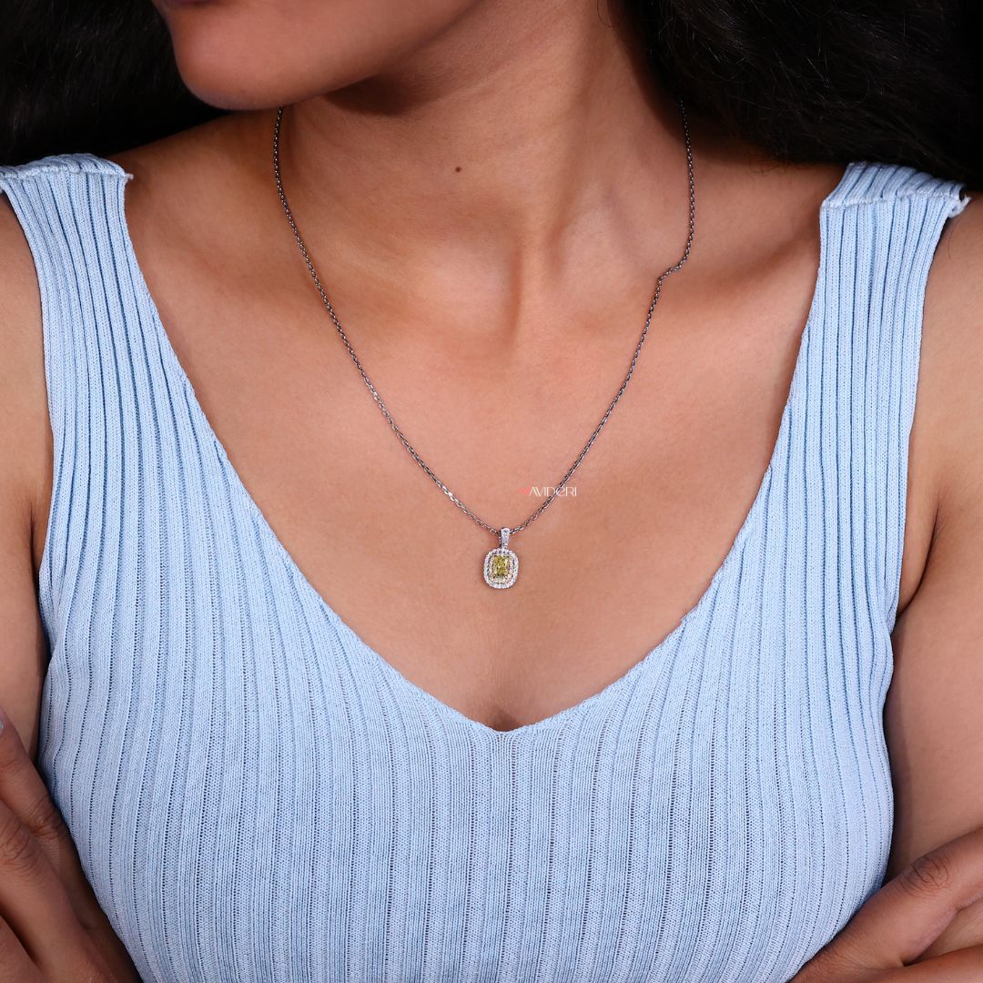 Handcrafted pendant with a double halo and unique yellow stone.