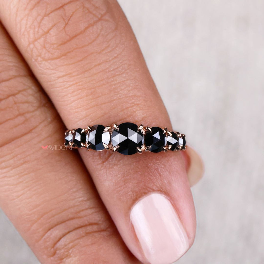 Rose gold wedding band featuring round cut diamonds for a timeless look.
