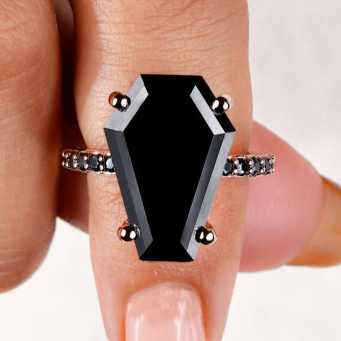 Coffin engagement ring featuring a stunning black moissanite ring.
