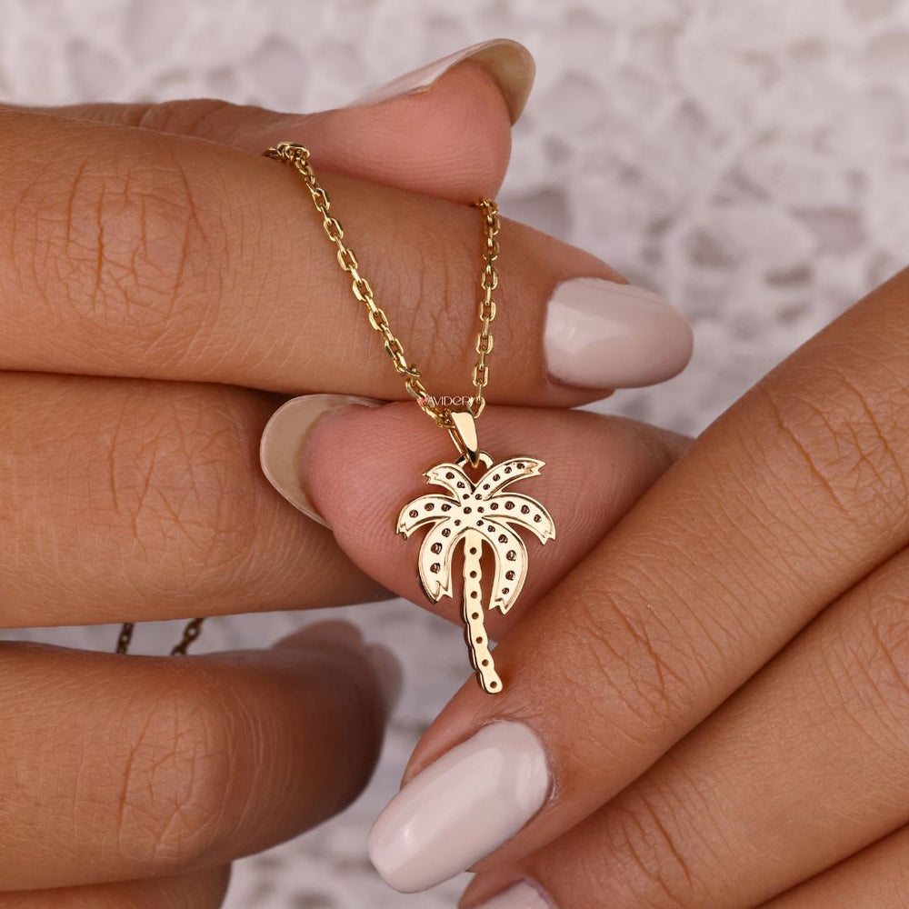 Palm tree pendant necklace with elegant charm.
