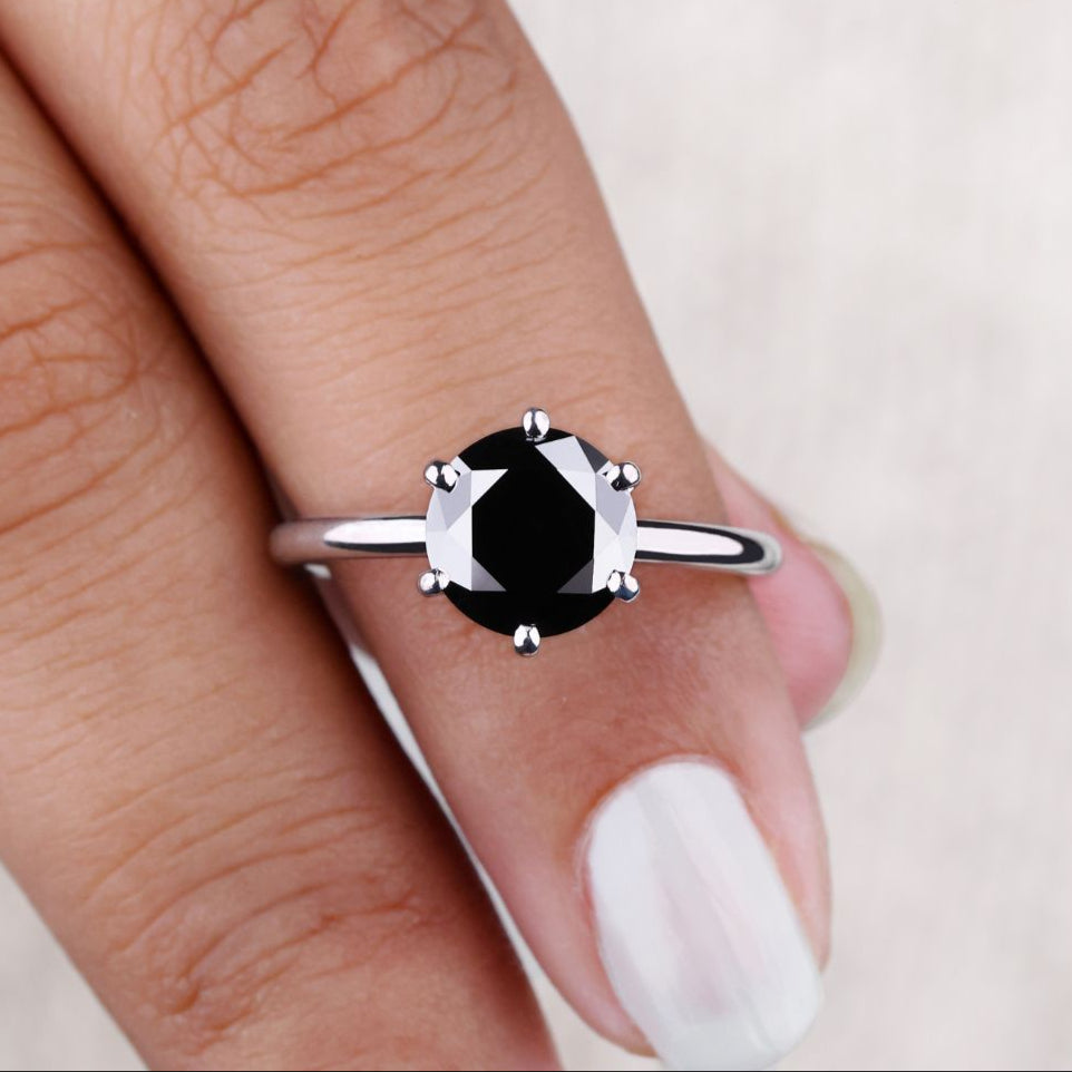 Round cut ring with a brilliant sparkle, perfect for engagement.
