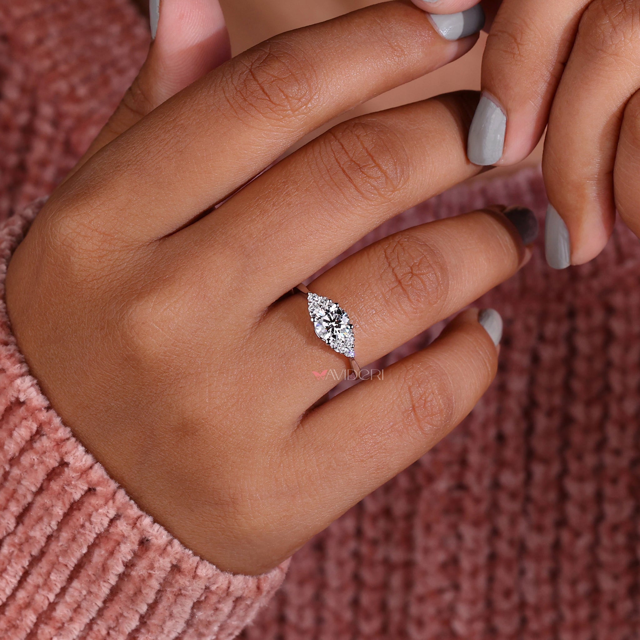Unique Tapered Shank Engagement Ring with stunning diamond accents.