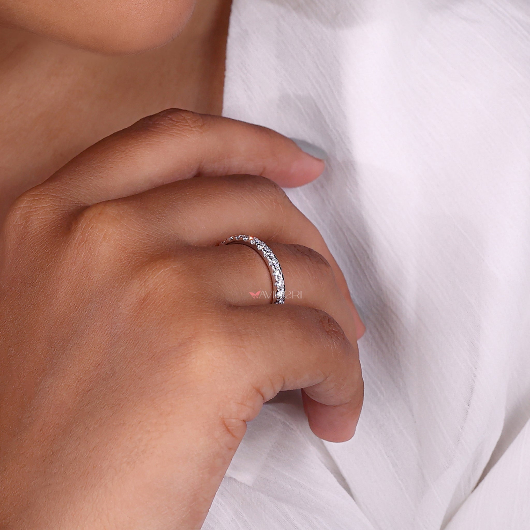 Half eternity wedding band with a delicate diamond setting.
