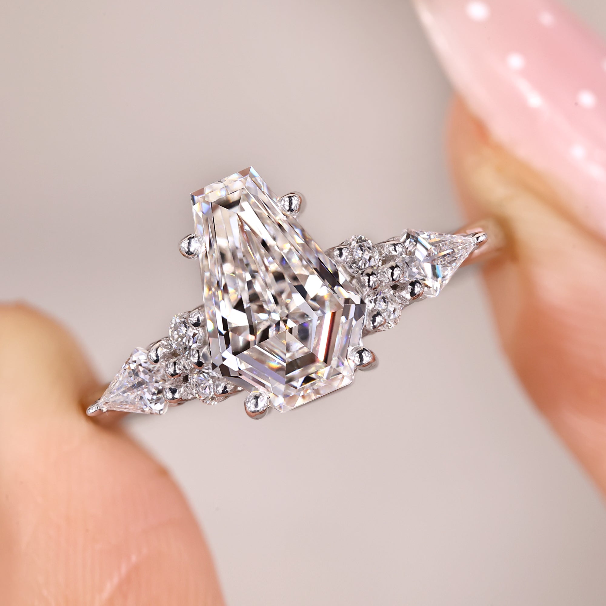 Seven stone coffin cut diamond ring in white gold design.