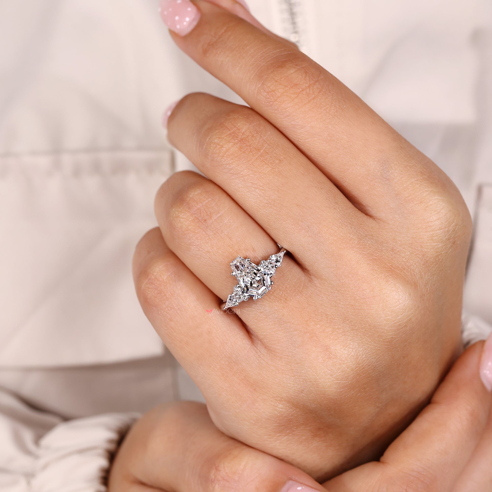 Avideri handmade coffin cut diamond ring with muse setting.