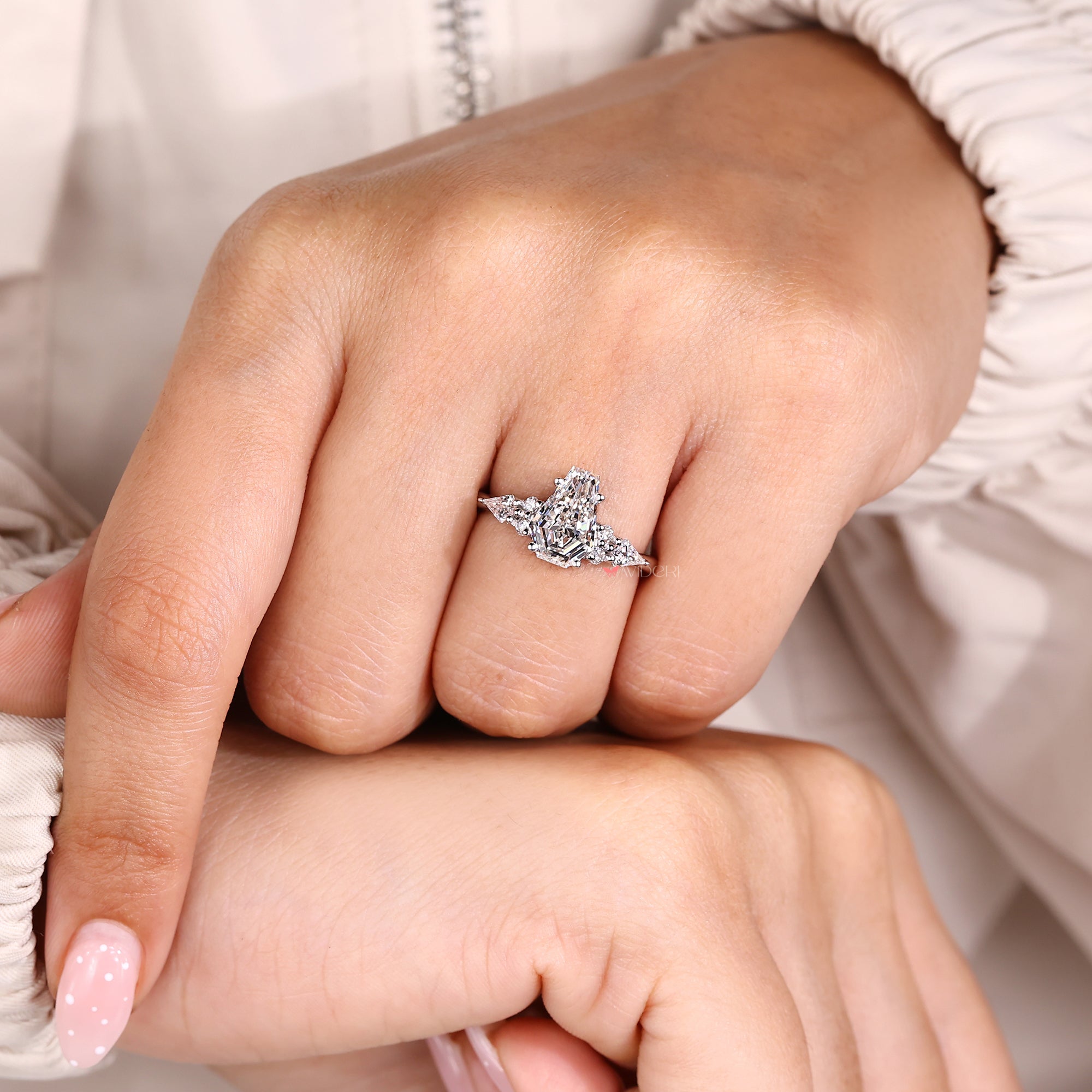 Lab grown coffin cut diamond engagement ring with side stones.