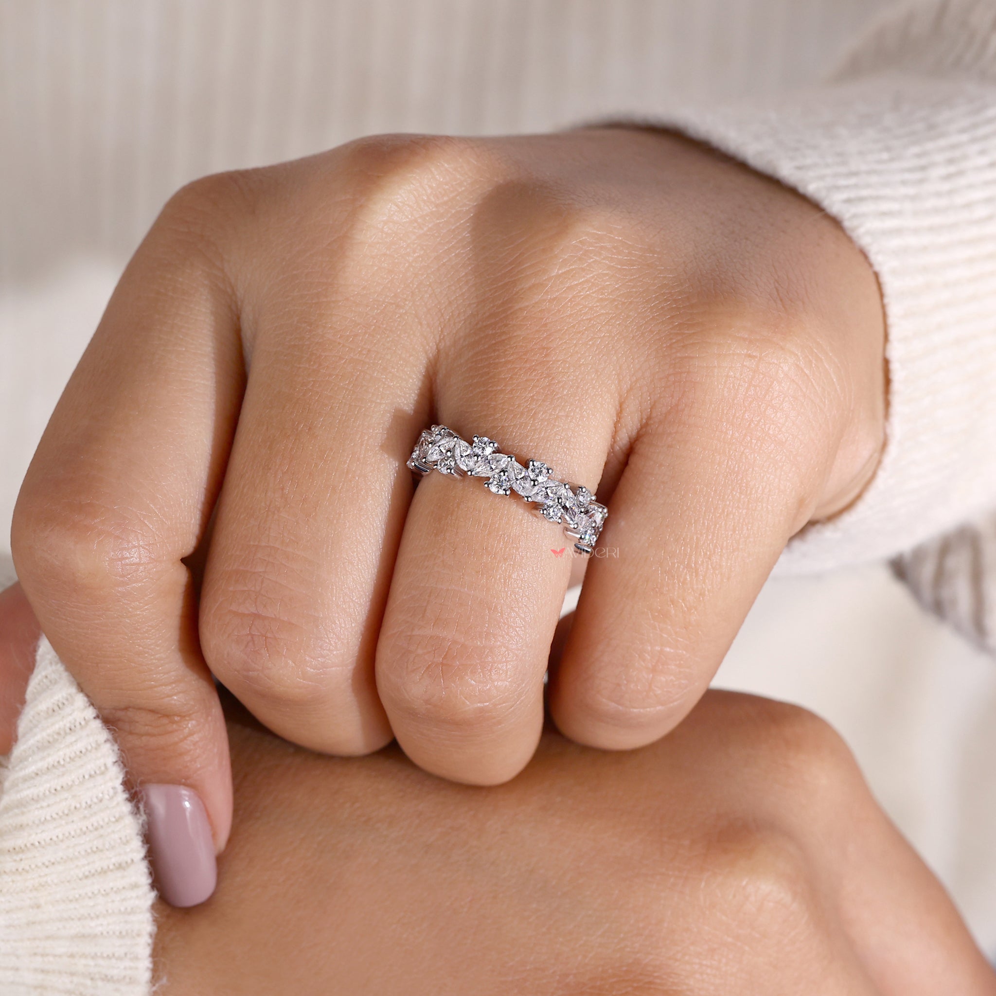 Handmade jewelry with unique diamond band designs.

