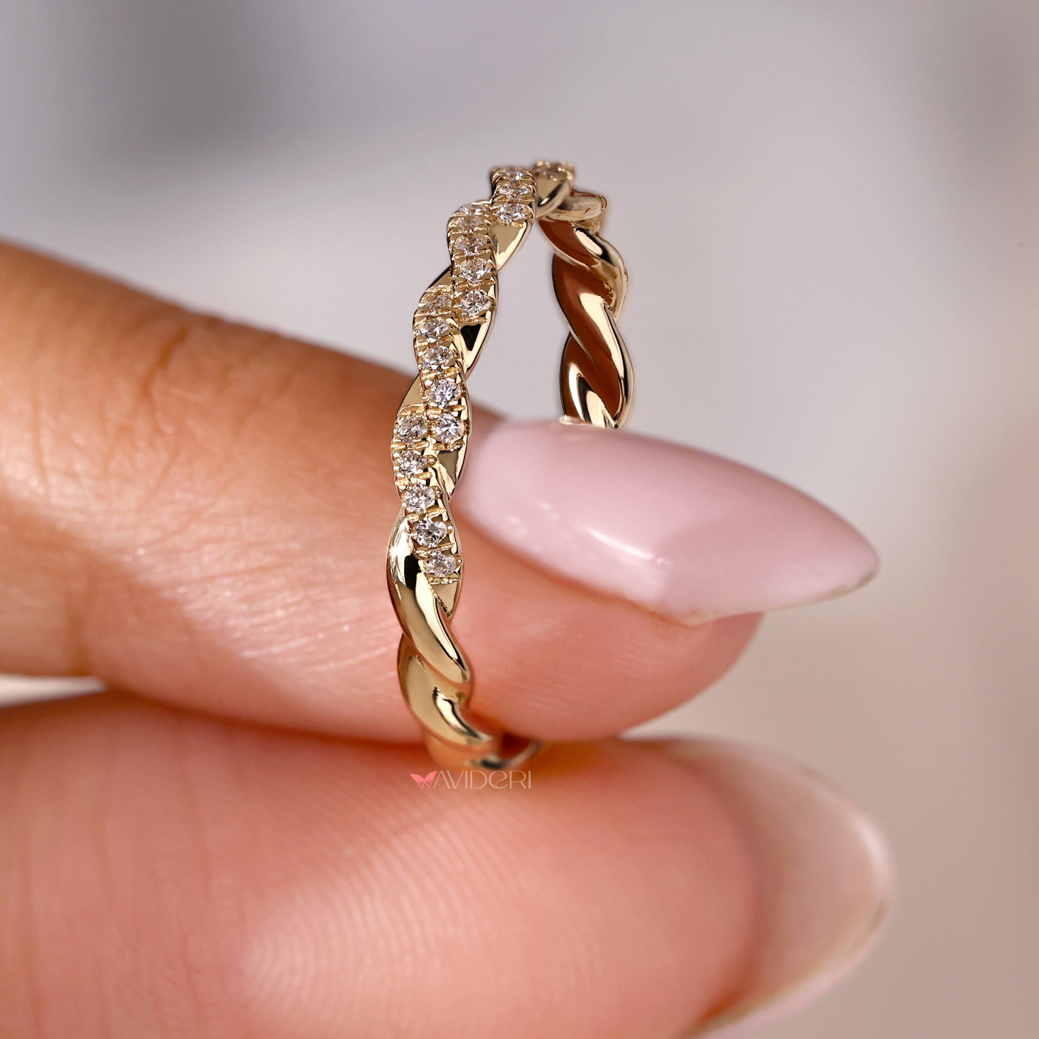 Yellow gold diamond band with sparkling round diamonds for luxurious appeal.
