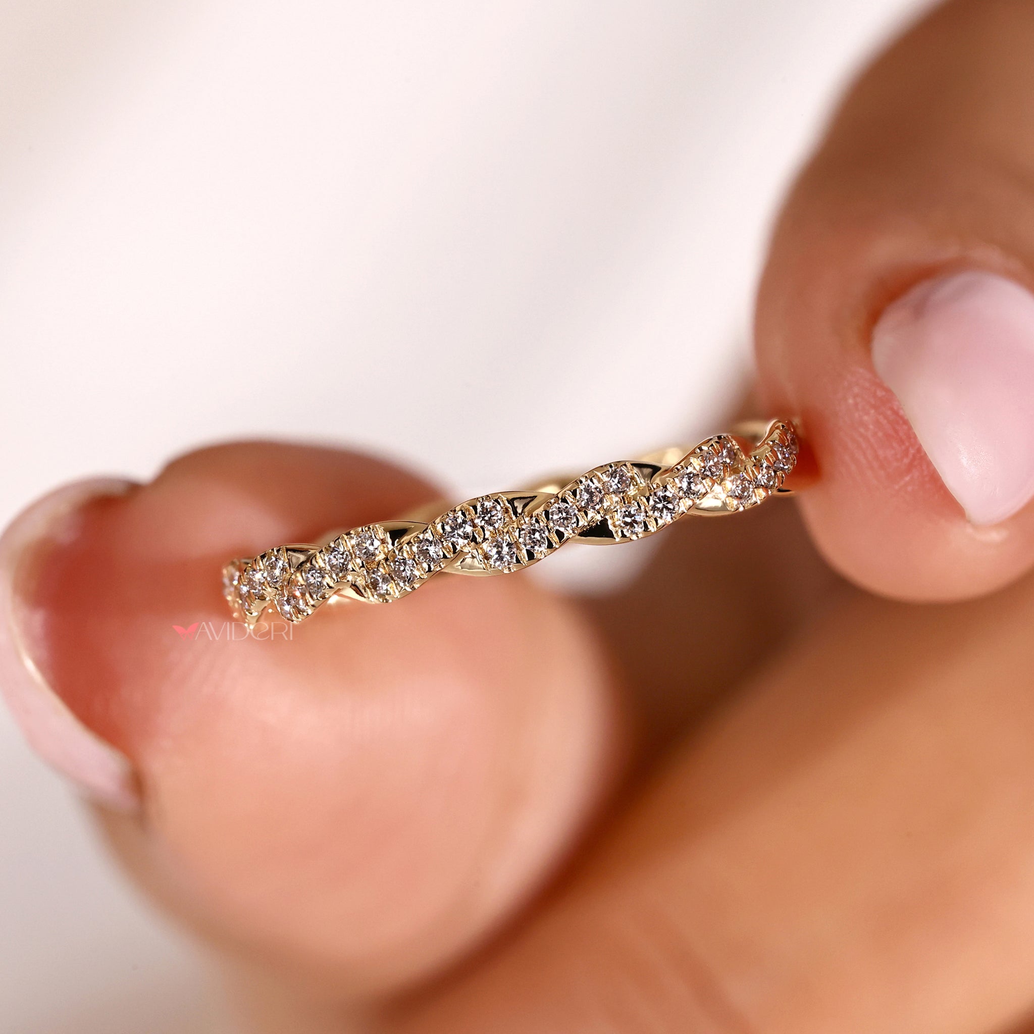 Twisted wedding band with a modern and stylish design.
