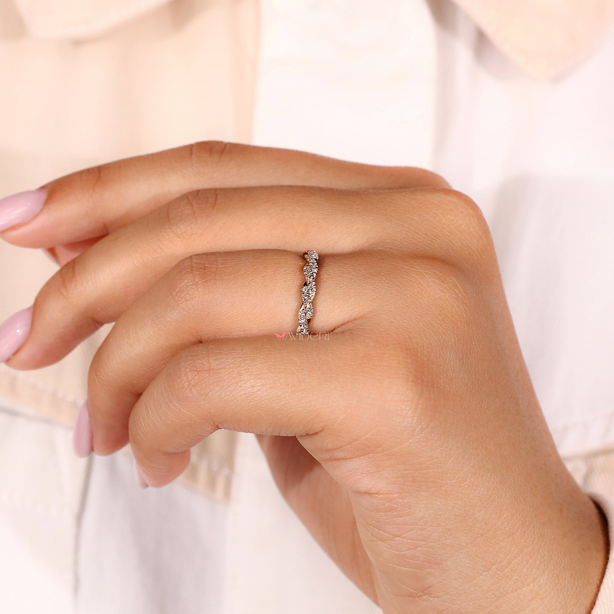 Twist wedding band blending elegance with unique design elements.
