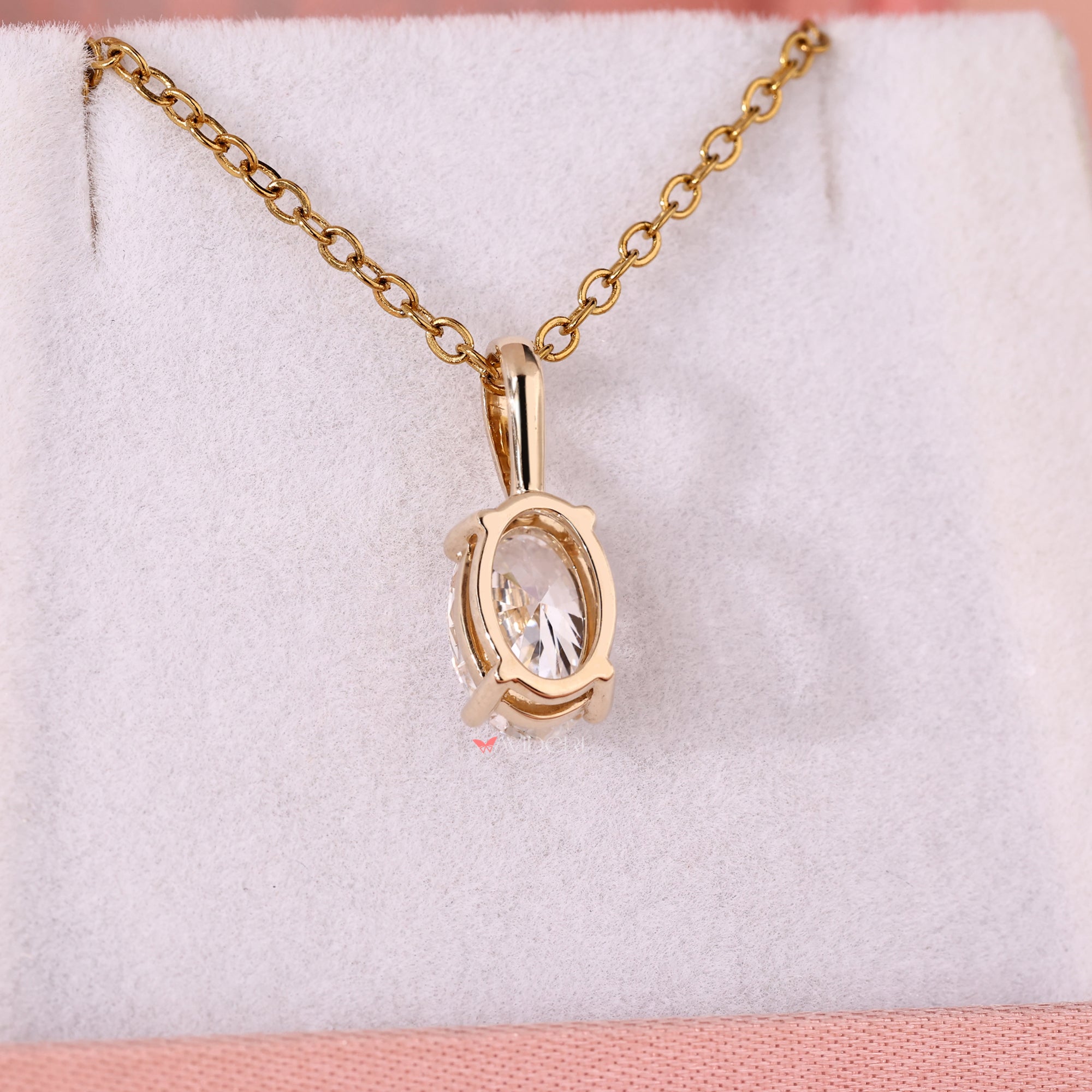 Yellow gold pendant featuring a lab grown oval solitaire diamond.