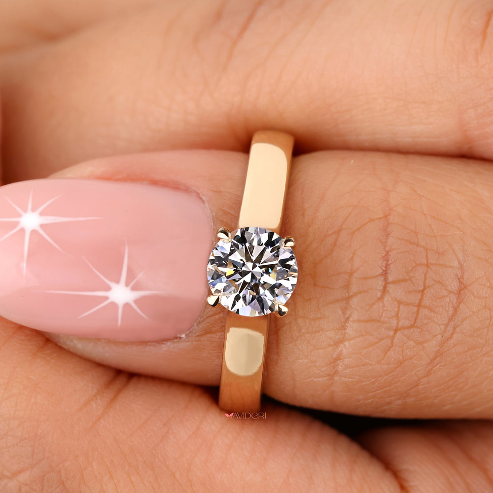 Minimalist solitaire engagement ring with a dazzling diamond.

