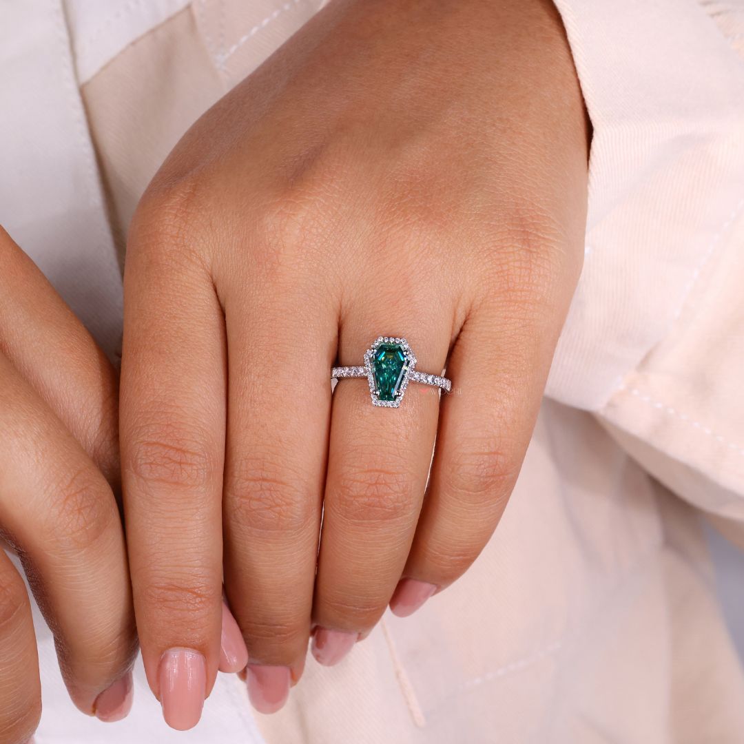 Unique promise rings for her displayed on a jewelry stand.
