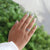 Buy moissanite ring combined with halo oval ring engagement design.