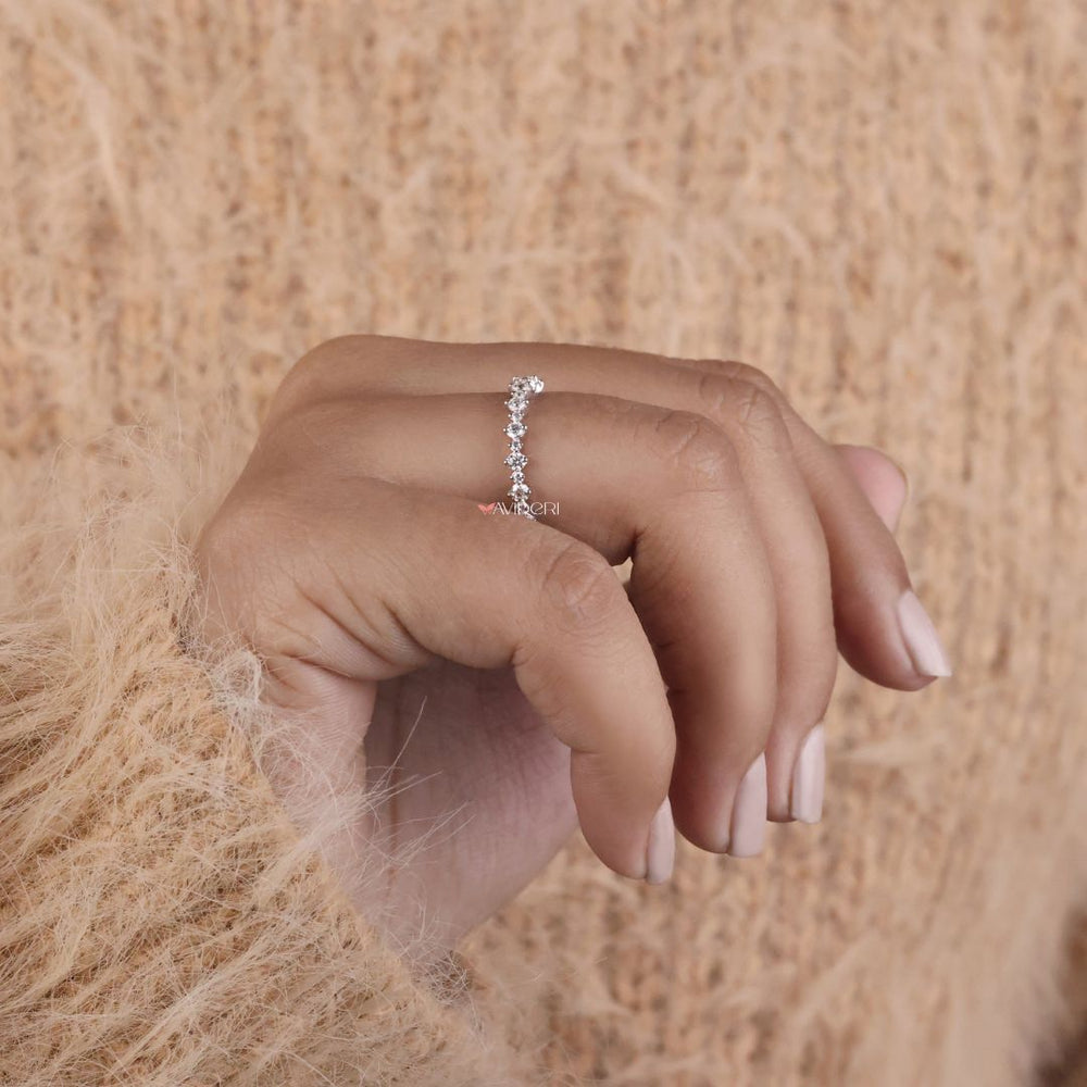 This moissanite gold wedding band is perfect for those who prefer lab-created stones in rich settings.
