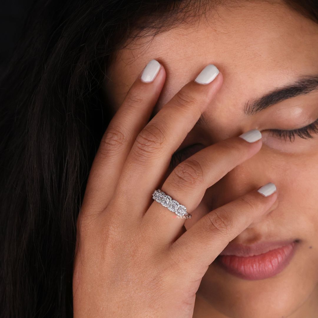 Moissanite wedding band features sustainable moissanite stones set in an elegant design.
