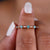 Cyan blue round wedding band features vibrant stones for a bold, modern look.
