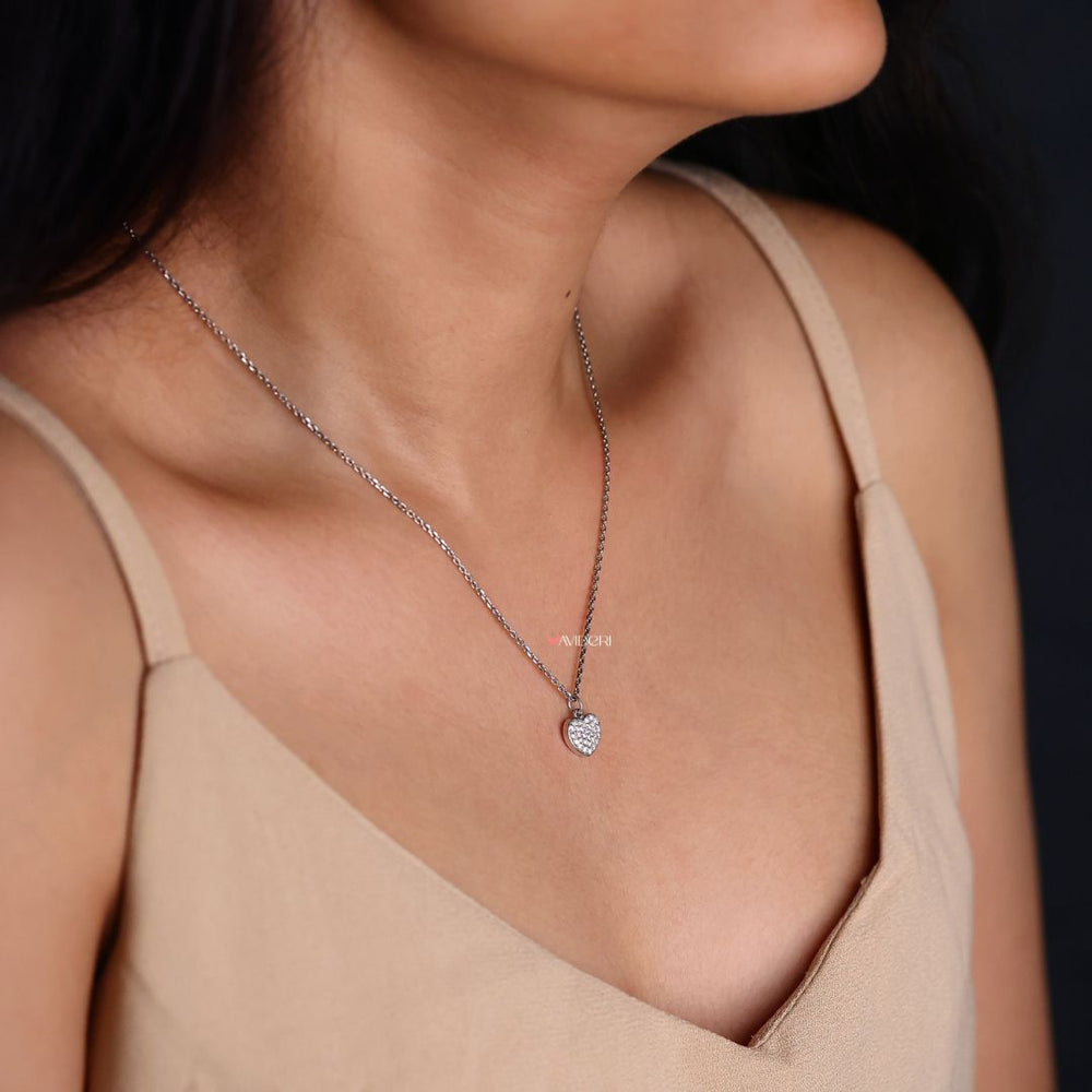 Heart shape pendant with a stunning round moissanite stone.
