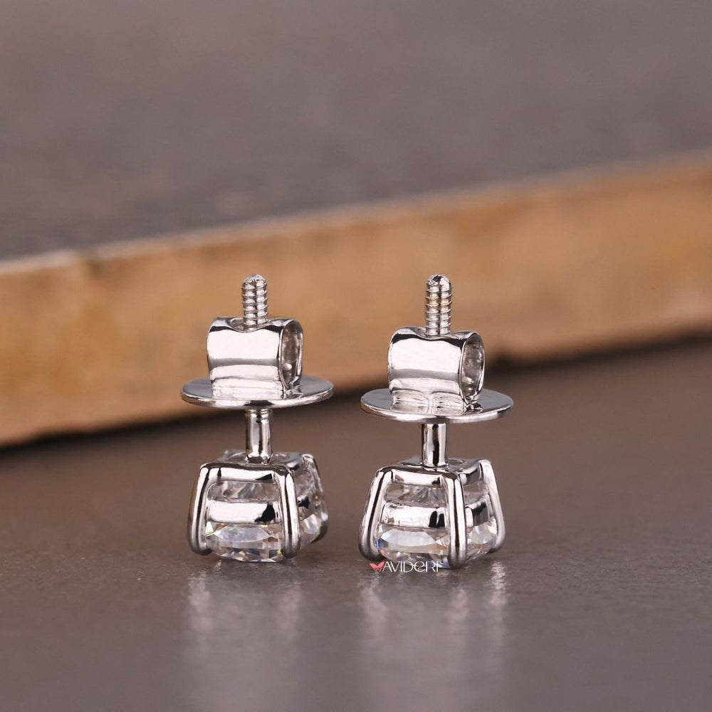 White gold earrings offer a sleek, cool-toned look.