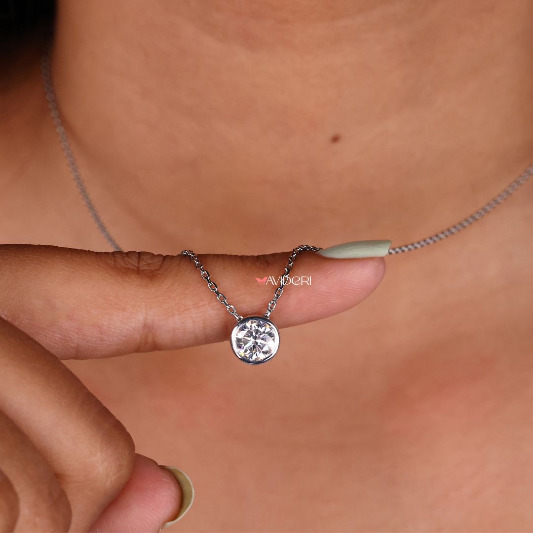 Round moissanite pendant with a classic bezel setting design.
