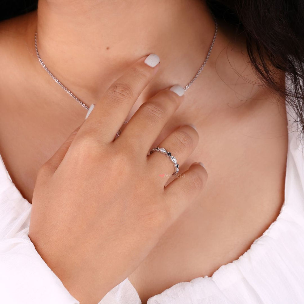 White gold wedding band shines with a polished finish, perfect for any bridal style.
