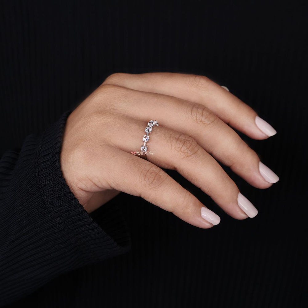 Distance pave band adds spaced brilliance with a modern minimalist look.
