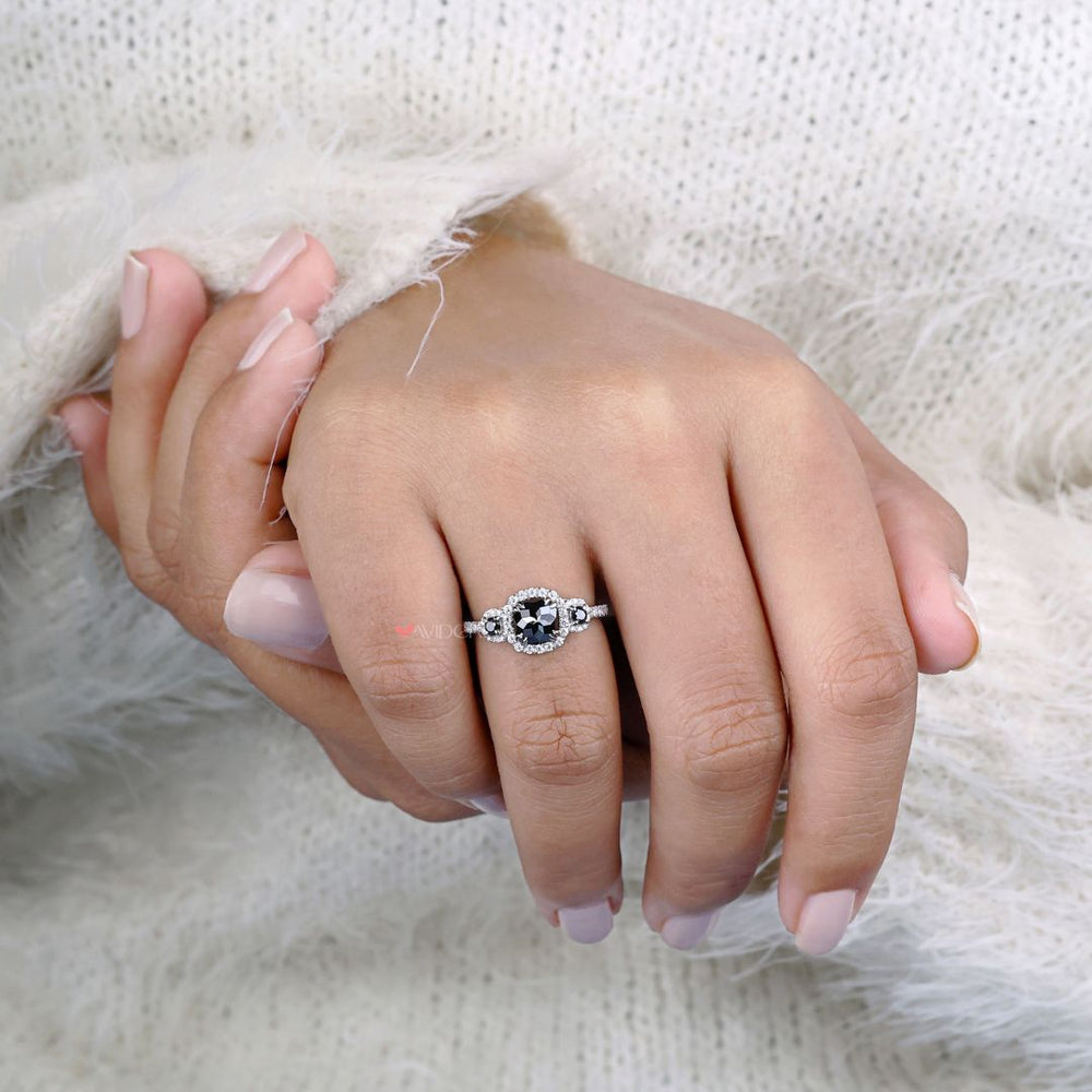 Halo engagement ring with a cushion cut moissanite and stunning pave accents.
