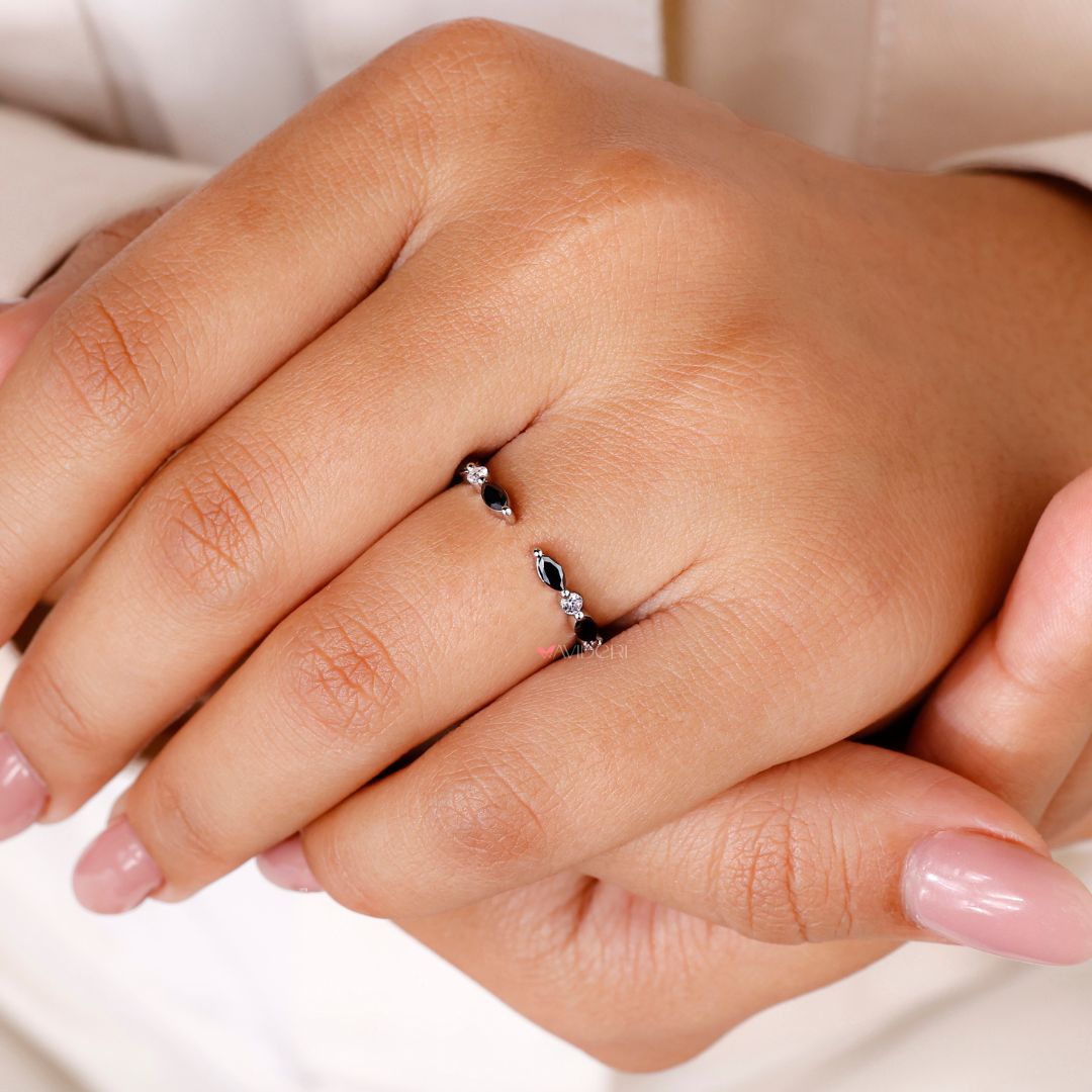 An open gap wedding band creates a sleek, modern look.