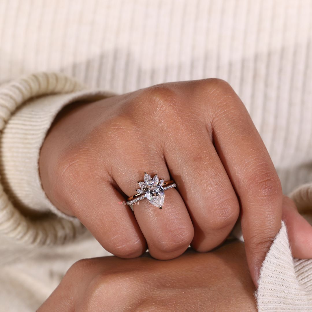 Marquise Cut Wedding Band complements the pear-shaped design.