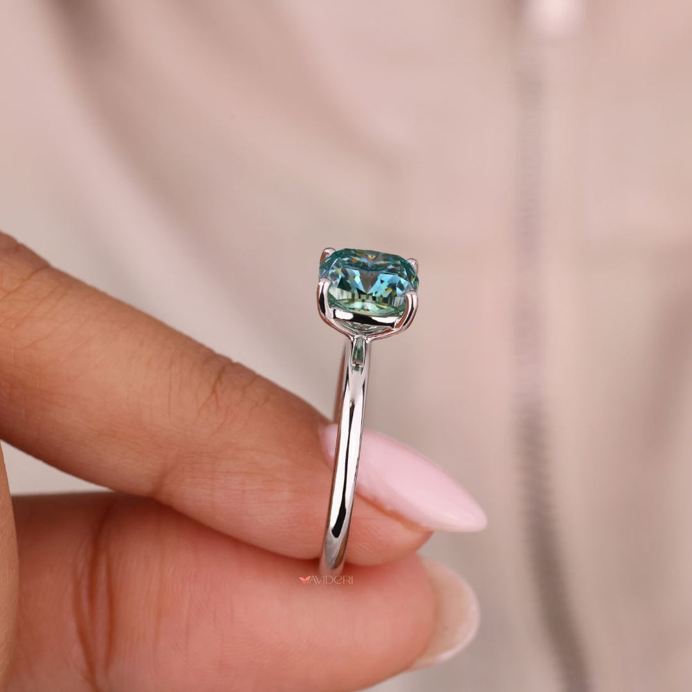 Handmade ring with a cushion cut diamond for a unique, custom feel.
