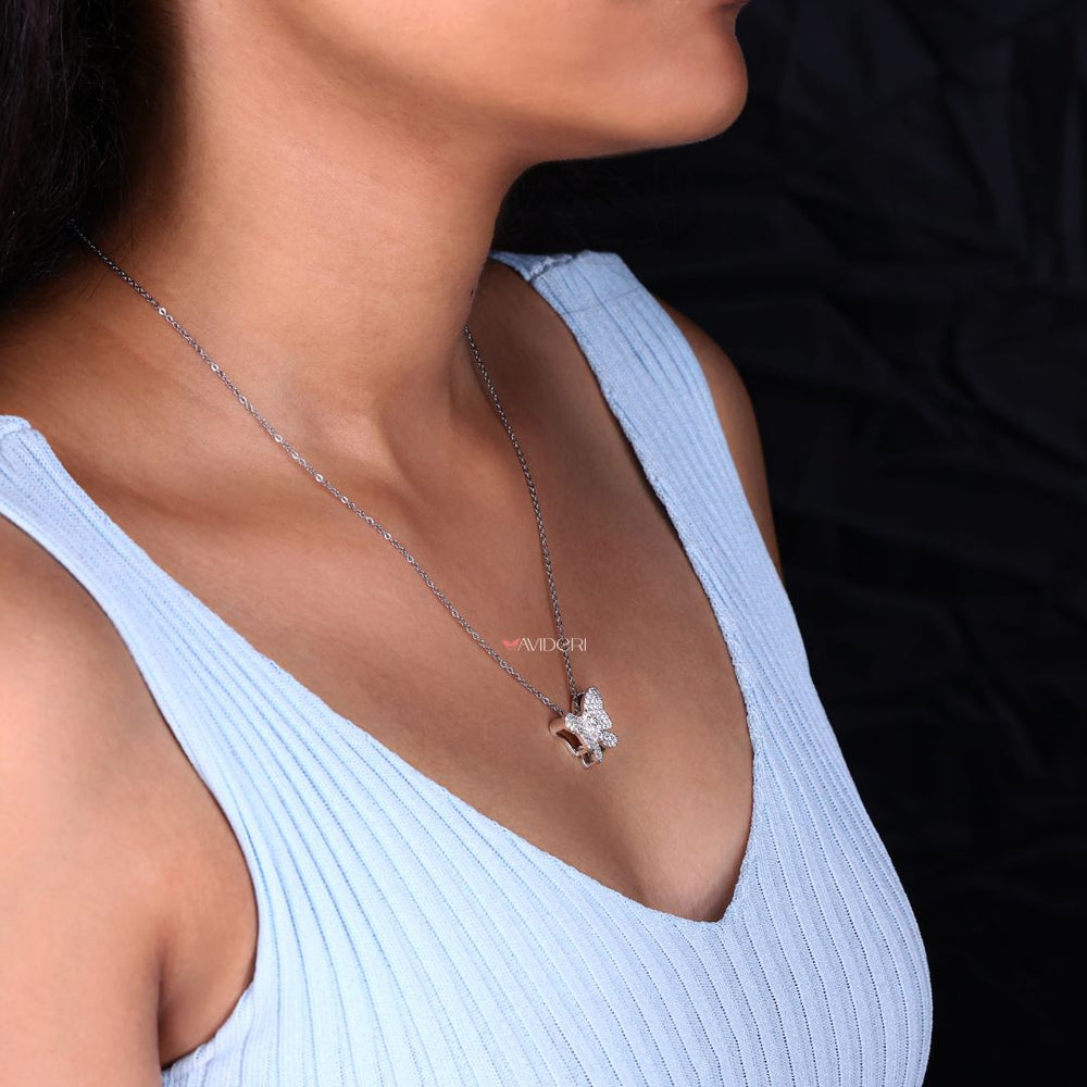 White gold butterfly pendant with graceful curves
