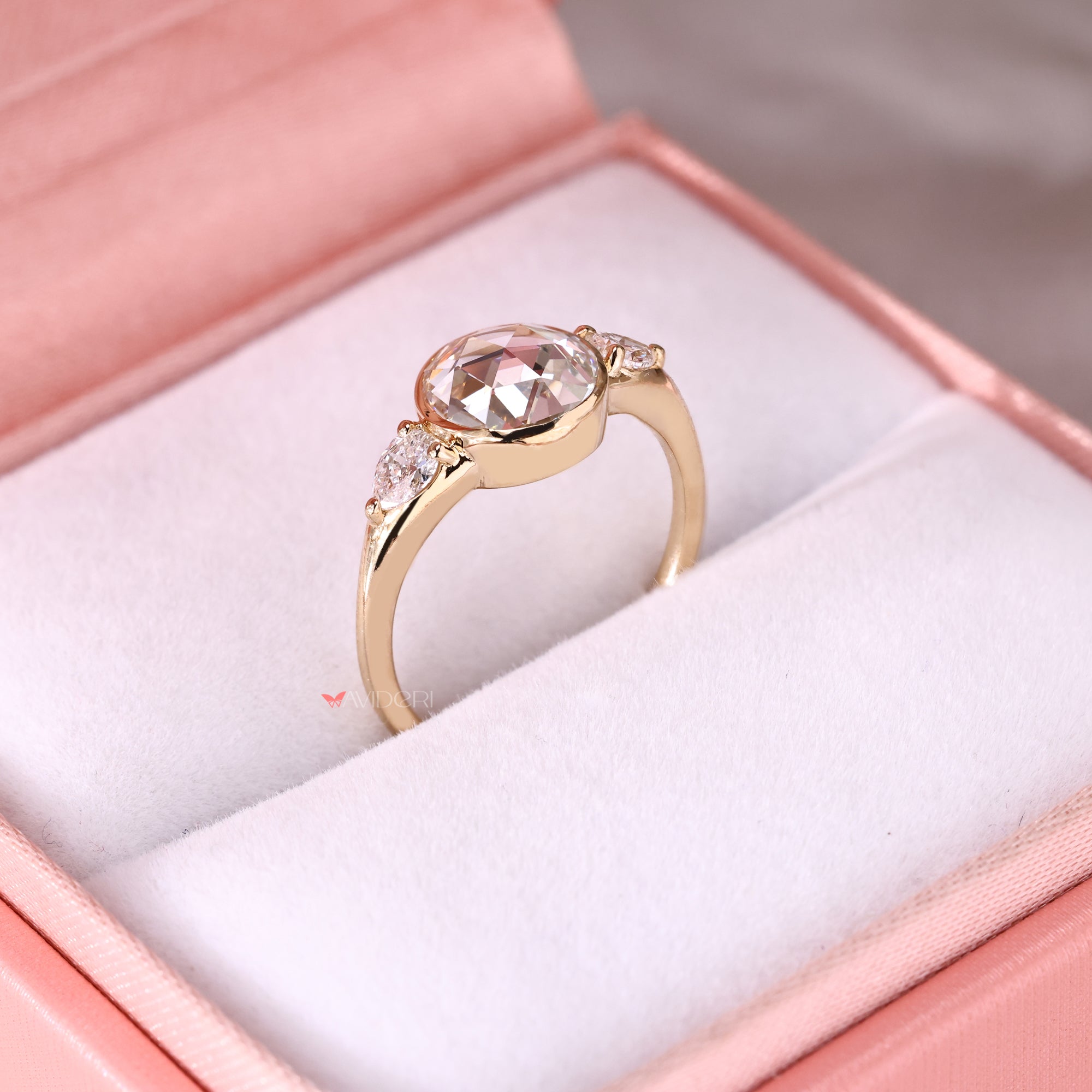 Yellow gold engagement ring in lab-grown diamond ring.

