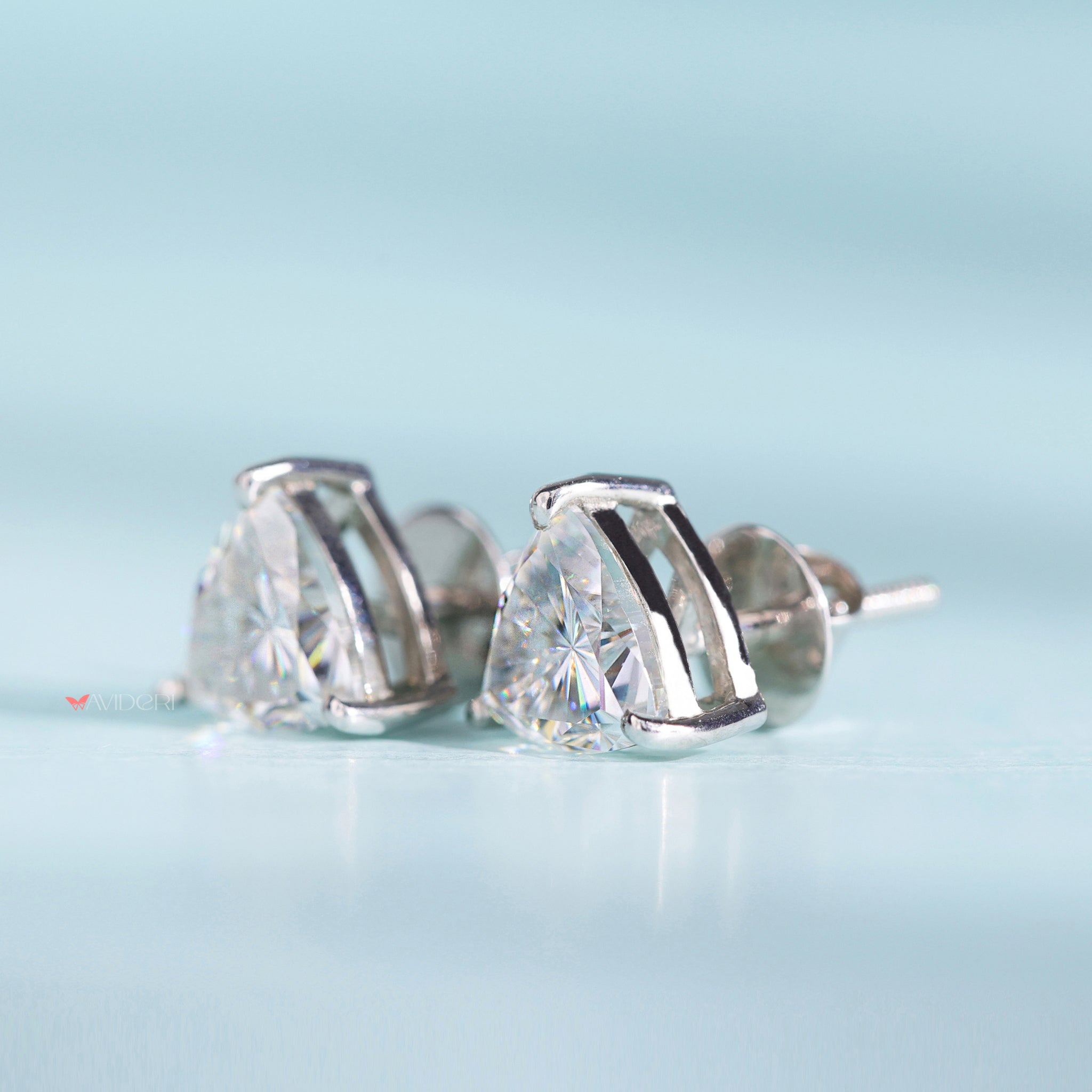 Three prong earrings add elegance with secure gemstone settings.