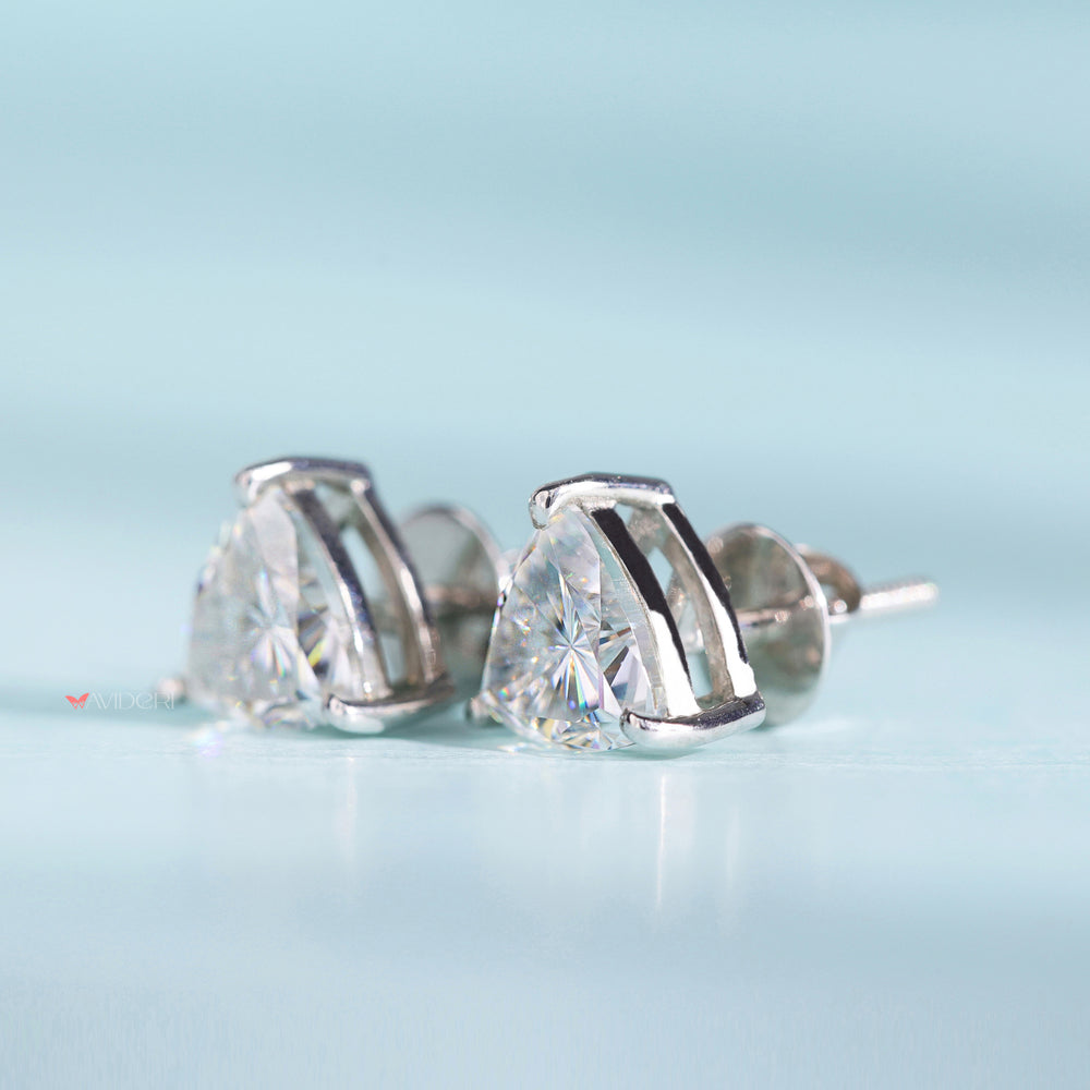 Three prong earrings add elegance with secure gemstone settings.