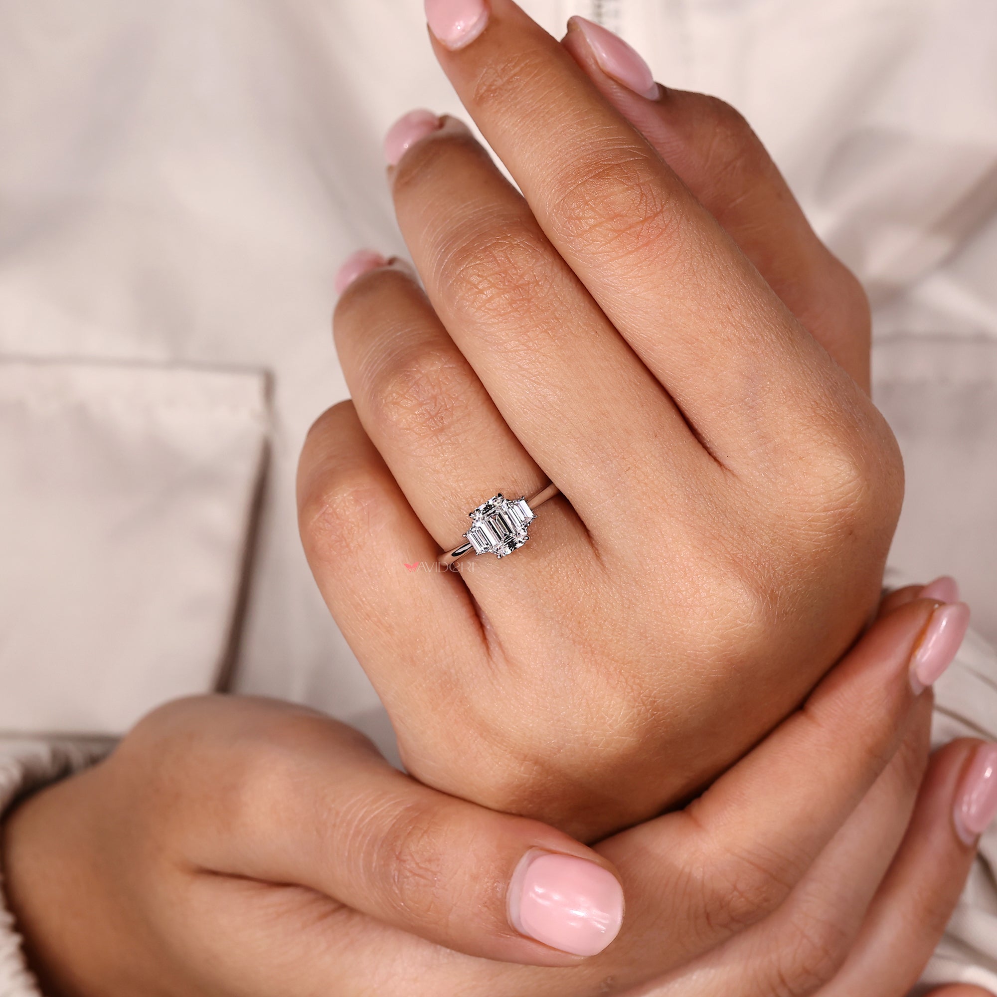 Handmade 3 stone engagement ring with IGI certified emerald center diamond.