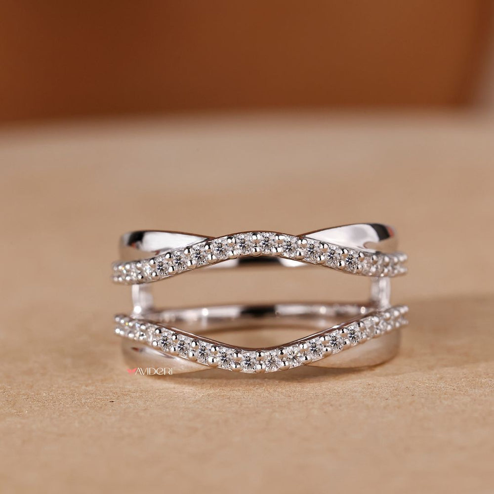 A white gold wedding band offers a sleek, polished finish.