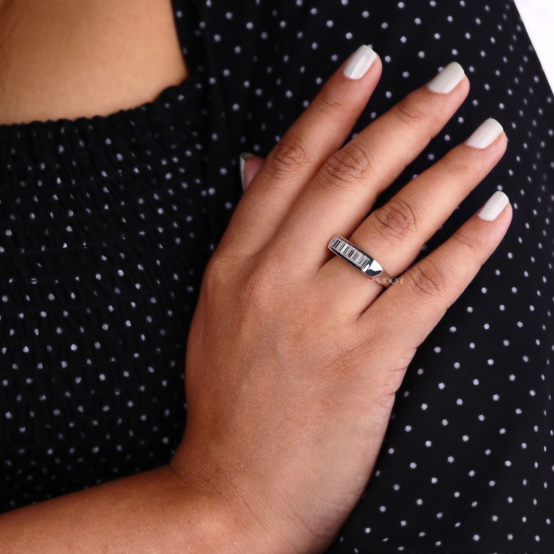 Channel setting band secures stones in a sleek, modern layout with continuous shine.

