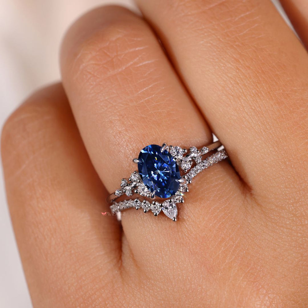 Blue moissanite ring set in a claw prong setting for a vibrant sparkle.