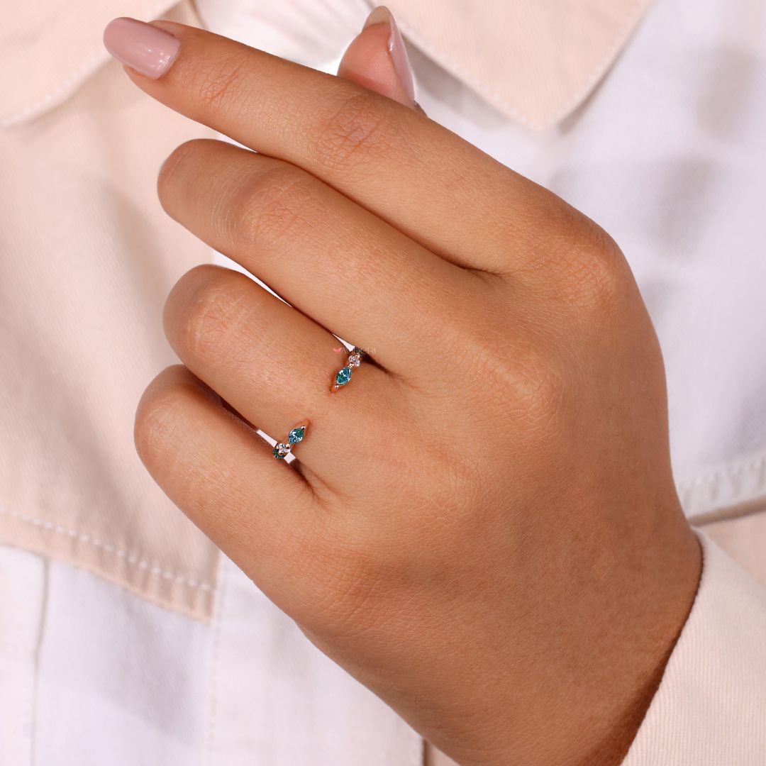 A marquise and round moissanite band combines two stunning shapes.