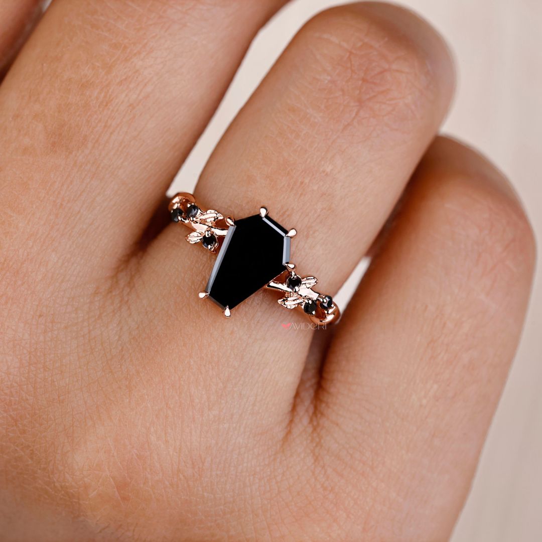 Round brilliant cut ring with a sleek coffin engagement ring setting.
