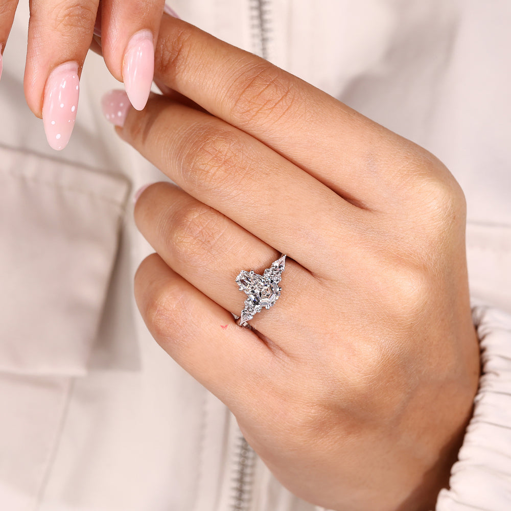 Coffin cut engagement ring with muse setting and kite sides.