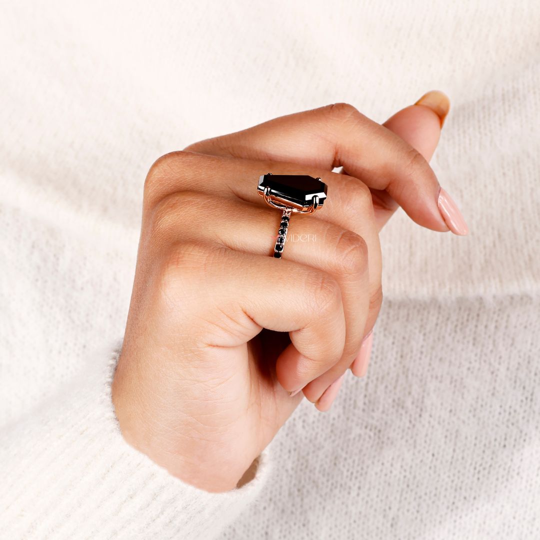 Handmade ring with a coffin design and black moissanite stone.
